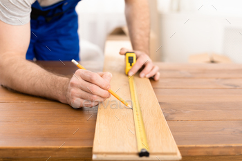 Unrecognizable Carpenter Measuring Wooden Board Making Furniture Indoor / Photodune, Misc