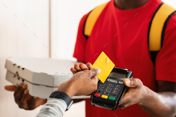 Unrecognizable Customer Paying Courier Putting Credit Card To Terminal Indoors / Photodune, Misc