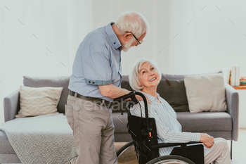 Senior couple, wife takes care of invalid husband / Photodune, Misc