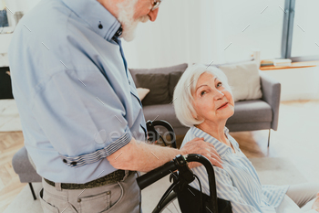 Senior couple, husband takes care of invalid wife / Photodune, Misc