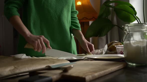 Mother cooking homemade cookies with cherry at home