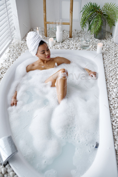 Attractive woman relax in the bath with foam / Photodune, Misc