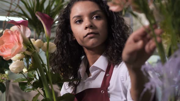 Young Florist Making Composition of Fresh Flowers