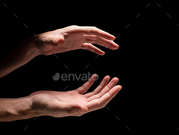 Male hands on a black background. / Photodune, Misc