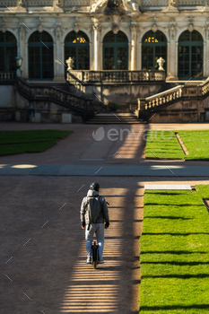 A man on a monowheel rides through the sights of Dresden, Saxon Switzerland, Germany / Photodune, Misc