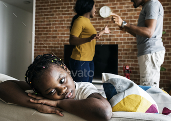 Daughter sad while her dad and mom fighting / Photodune, Misc