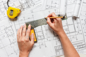 architect design working drawing sketch plans blueprints and making architectural construction model / Photodune, Misc