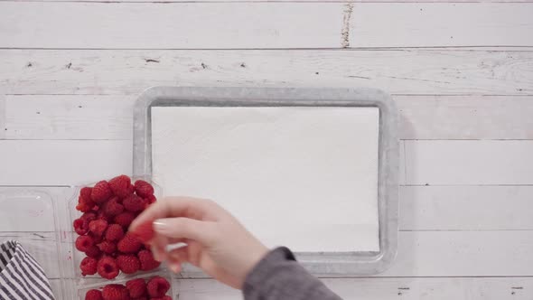 Time lapse. Flat lay. Mixing ingredients to bake chocolate raspberry cupcakes.