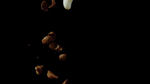 Chocolate cereal flakes and of milk pouring, Ultra Slow Motion