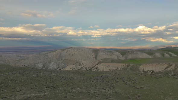 4K UHD Aerial drone view beautiful sky before sunset over silhouette mountain