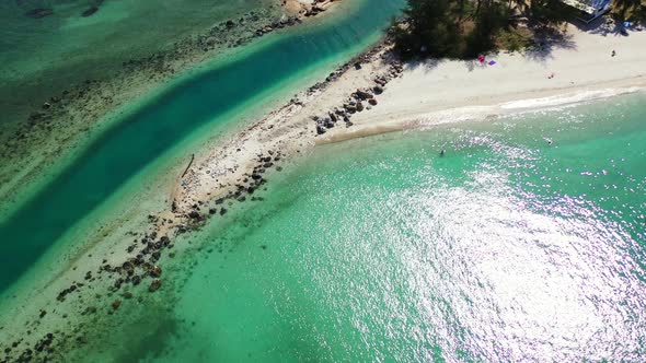 Crystal clear emerald water and sandy river mouth on the tropical island coast. Koh Phangan, Thailan