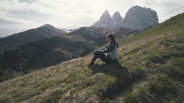 Slow Motion Shot of Happy Young Woman Walks in the Dolomites Mountains Northern Italy in the Summer