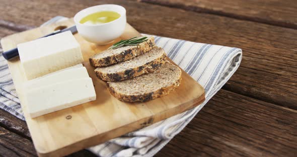 Slices of bread, cheese, sauce and knife