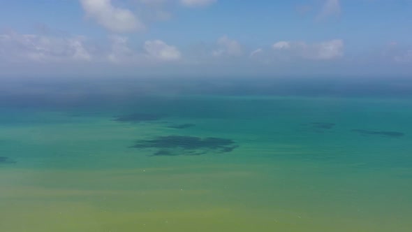 Tropical Blue Sea and Blue Sky with Clouds