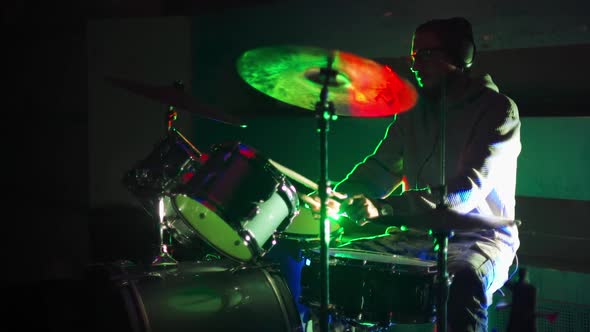 Drummer Playing Drums in the Nightclub