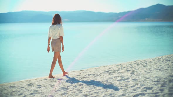 Female Model Walking on the White Sandy Beach of the Clear Tropical Turquoise Sea