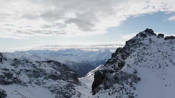 Snowy Mountains Against Cloudy Sky Around Drone View of Amazing Mountain Ridge of Alps Covered with