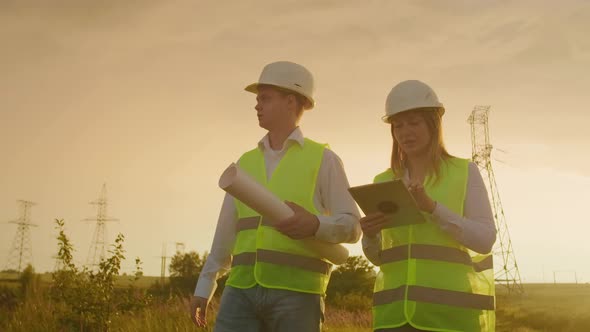 Coworking Engineers with Tablets on Solar Plant