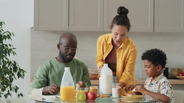 Happy Afro Family Having Breakfast at Home