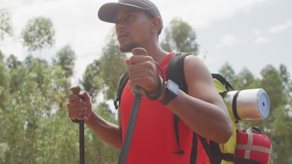 Sporty mixed race man with prosthetic leg hiking