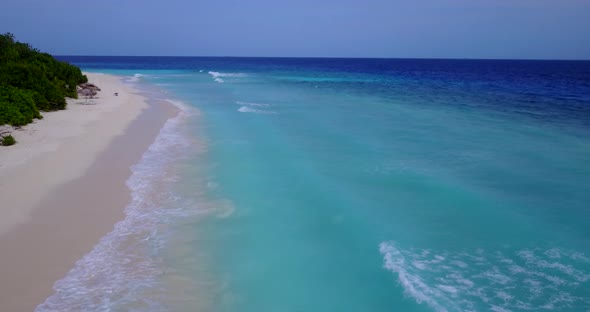 Wide aerial abstract view of a summer white paradise sand beach and aqua blue water background in co