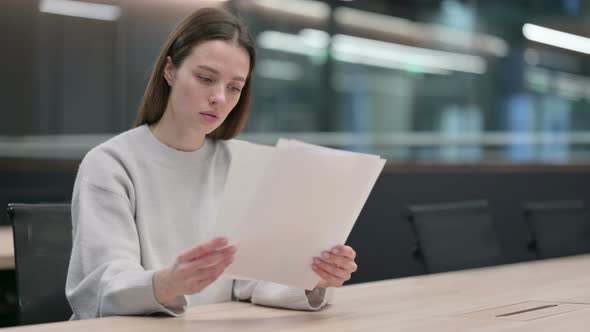 Woman Upset by Loss on Documents