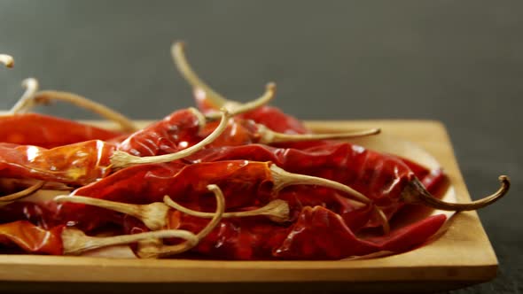 Dried chili pepper in wooden tray 4k