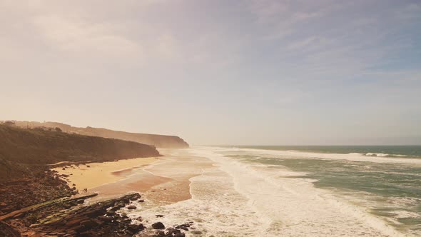 Aerial Drone View of Praia Grande Sandy Beach with Cliffs, showing Coastal Scenery and Coastline at