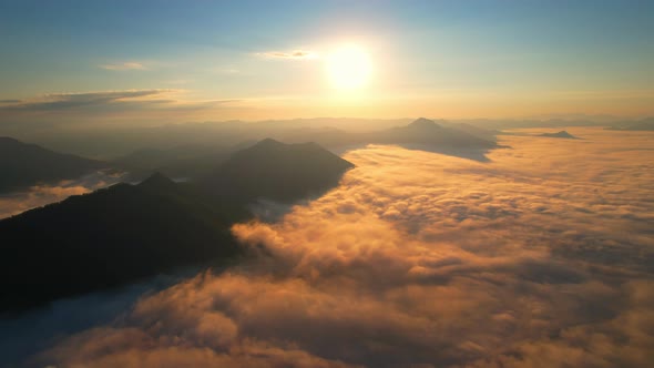 4K Drone Flying through the clouds at dusk or dawn. Aerial top cloudscape