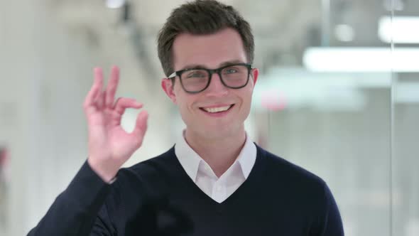 Young Businessman Showing Ok Sign with Hand