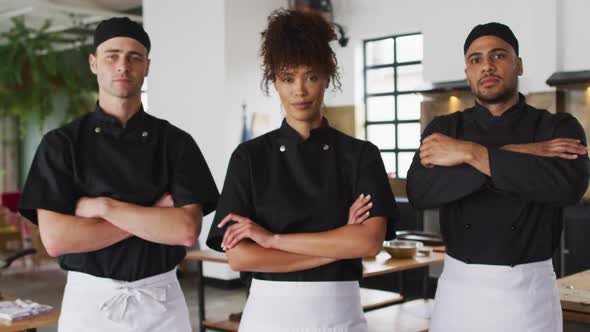 Diverse group of chefs crossing their hands