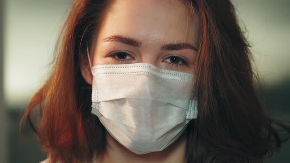 Young Student Teenager Girl in Protective Mask Standing Near Window on Home Self Isolation