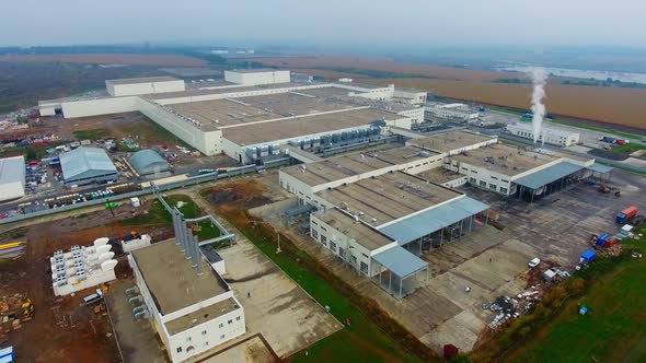 Modern industrial building exterior with aerial view. Gray industrial building from above.