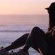 female model looking at the horizon with her marked silhouette, looking at pichilemu - VideoHive Item for Sale