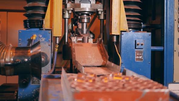 Small Copper Elements are Getting Released By a Factory Machine