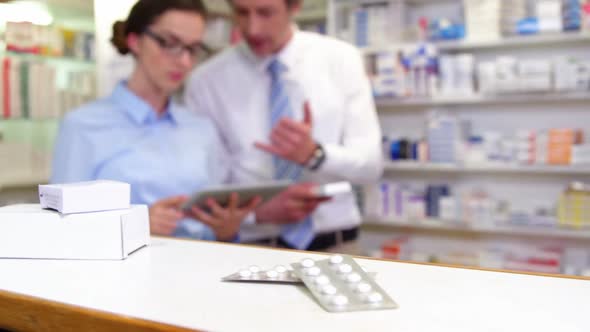 Various boxes and bottles of medicine on table