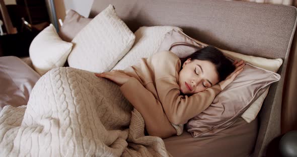 Woman Sleeping in Bed at the Morning