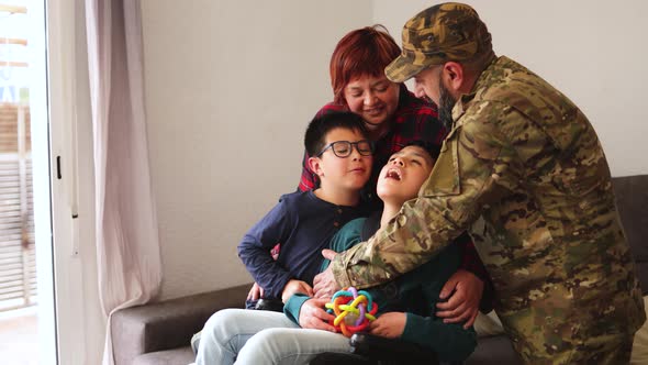 Military Soldier Having Tender Moment with Family After Homecoming Reunion Father Mother and Sons