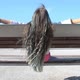 Brunette Preteen Girl with Blue Color Highlights Sitting on Bench on Bridge Back View Summer Day - VideoHive Item for Sale