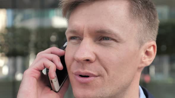 Close Up of Businessman Talking on Phone