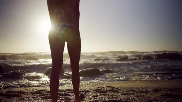 Woman walking on the beach 4k