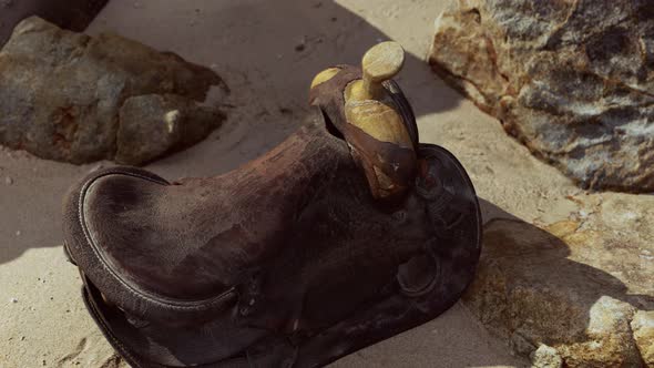 Very Old Horse Saddle on Sand Beach