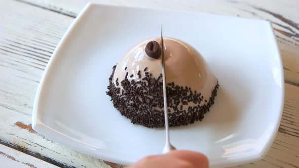 Knife Cutting Dome Shaped Cake