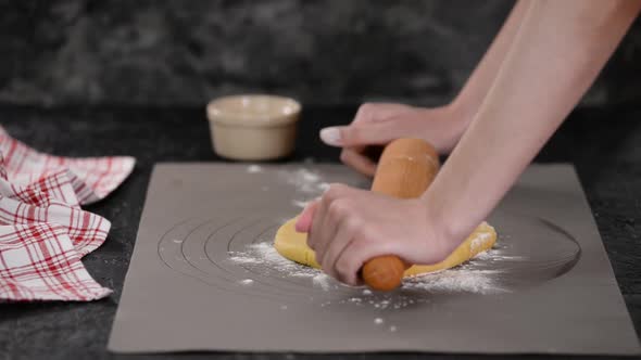 Woman Roll Out the Dough with Rolling Pen. Roll Out the Dough for Pies.