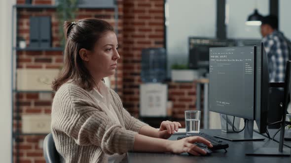 Programer Typing Source Code on Computer Keyboard Turning Head and Smiling