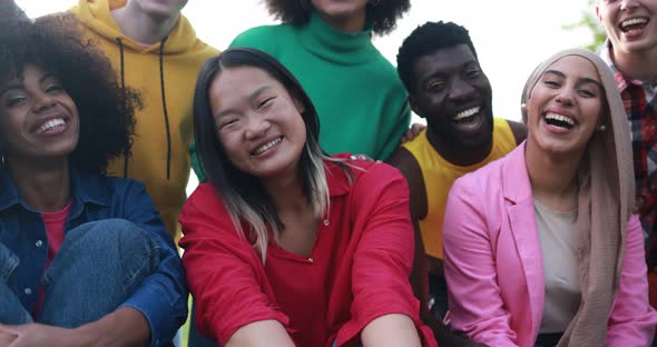 Young diverse people having fun outdoor laughing together - Diversity concept