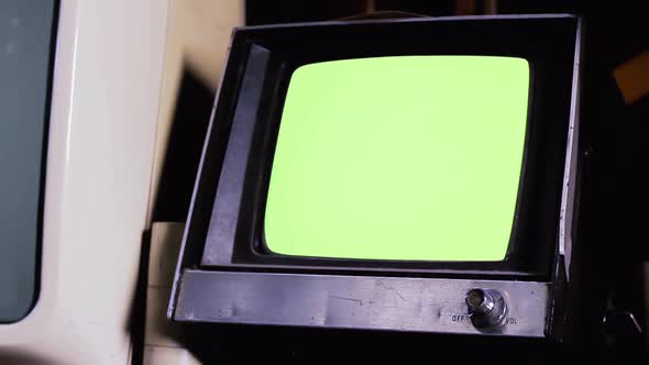 Vintage Portable TV Set with Green Screen.