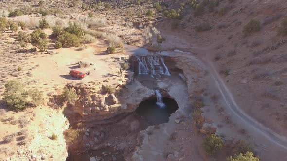 High aerial view of truck parked next to Toquerville Falls