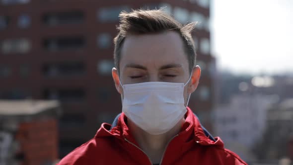 Virus Epidemic, Man Wearing Face Mask on the Roof of City