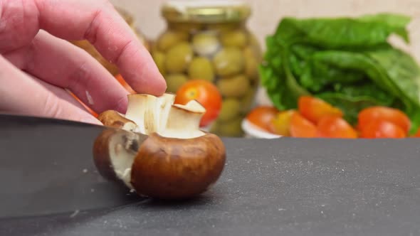 Slicing Brown Champignon Mushrooms Chopping Champignon with a Knife on a Cutting Board Preparing